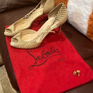 Cream /brown.2 1/2 inch heels. Christian Louboutin.Size 37 Euro woman shoes.